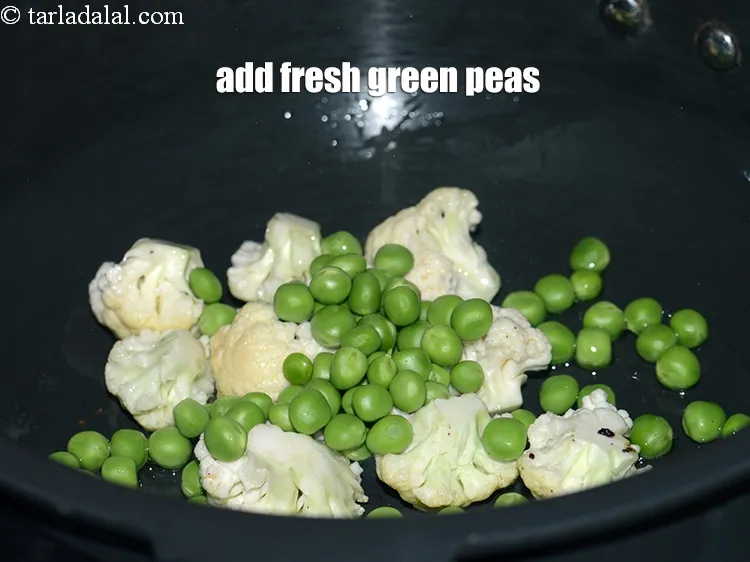 Step 14 – Add &frac14; cup fresh&nbsp;<a href="https://www.tarladalal.com/glossary-green-peas-matar-hare-matar-vatana-180i">green peas</a>.