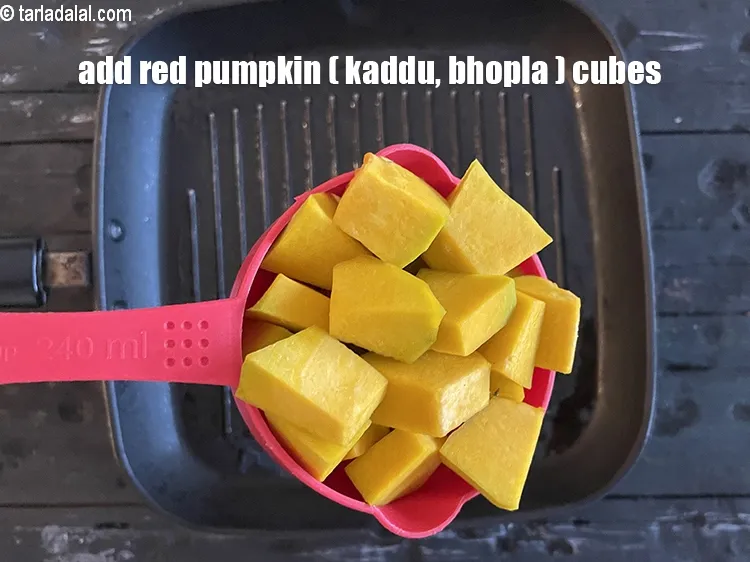 Step 17 – Add&nbsp;<meta charset="UTF-8" />1 cup&nbsp;<a href="glossary-red-pumpkin-cubes-1530i">red pumpkin (bhopla / kaddu) cubes</a>.
