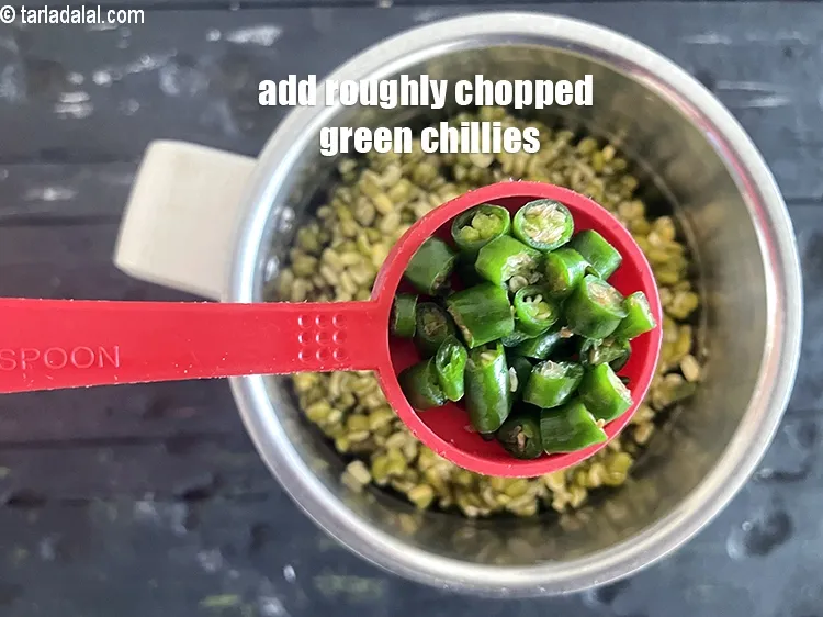 Step 13 – <meta charset="UTF-8" />Add 1 tbsp&nbsp;roughly&nbsp;<a href="https://www.tarladalal.com/glossary-chopped-green-chilli-820i">chopped green chillies</a>.&nbsp;Antioxidant&nbsp;<a href="https://www.tarladalal.com/recipes-for-Juices-Rich-in-Vitamin-C-805" target="_blank">vitamin C</a>&nbsp;in&nbsp;<a href="https://www.tarladalal.com/recipes-using-green-chillies-331">green chillies</a>&nbsp;protects the body …
