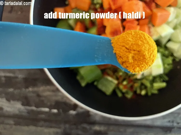 Step 23 – Add&nbsp;<meta charset="UTF-8" />1/4 tsp&nbsp;<a href="glossary-turmeric-powder-haldi-645i">turmeric powder (haldi)</a>.