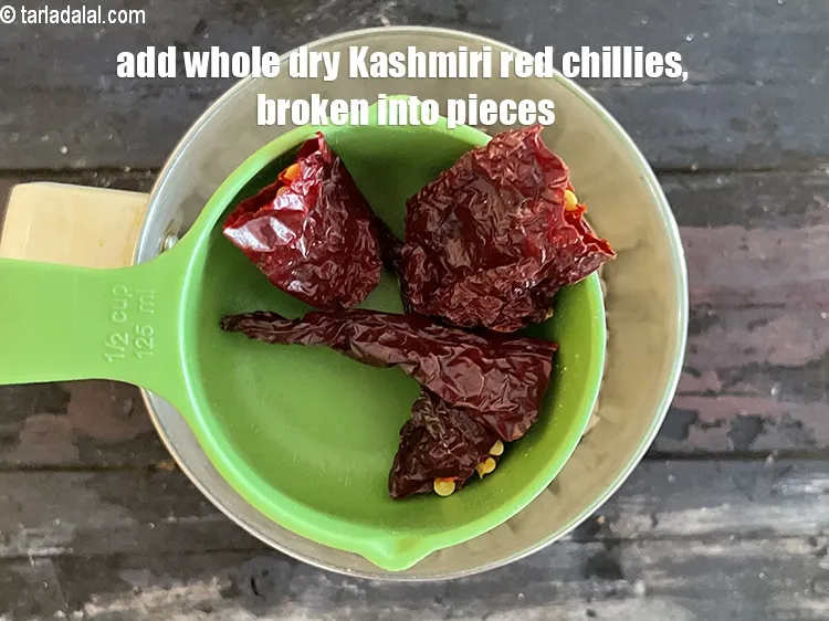 Step 15 – Add&nbsp;<meta charset="UTF-8" />2&nbsp;<a href="glossary-whole-dry-kashmiri-red-chillies-kashmiri-mirch-kashmiri-lal-mirch-332i">whole dry kashmiri red chillies</a>&nbsp;, broken into pieces.