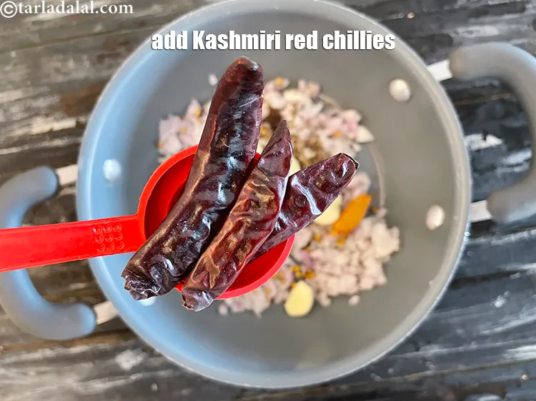 Step 22 – Add&nbsp;3 dry red kashmiri chillies , broken into pieces.