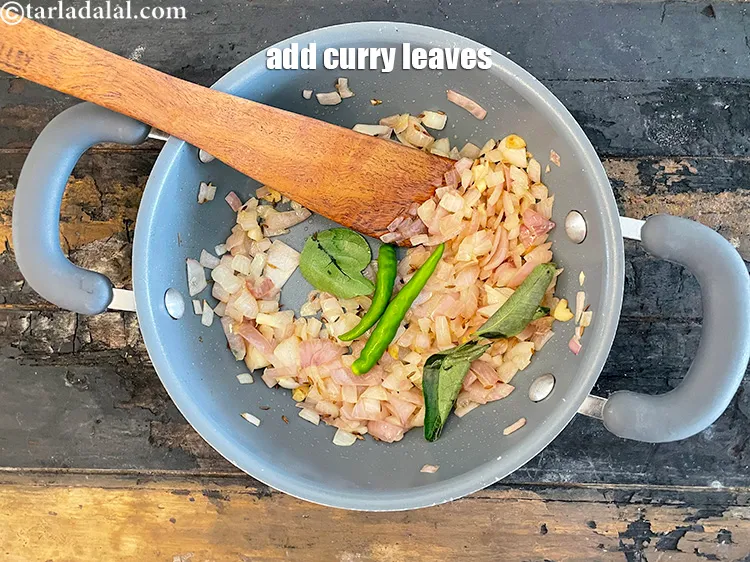 Step 14 – Add&nbsp;<meta charset="UTF-8" />5&nbsp;<a href="glossary-curry-leaves-kadi-patta-kadipatta-388i">curry leaves (kadi patta)</a>.