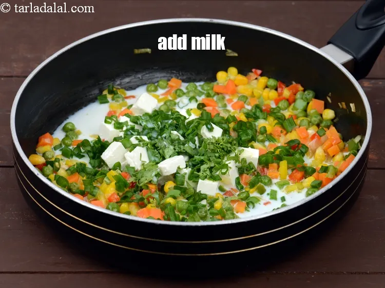 Step 12 – Add 1/4 cup&nbsp;<a href="https://tarladalal.com/glossary-milk-doodh-full-cream-milk-514i">milk</a>.&nbsp;