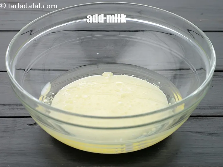 Step 13 – Add 3/4 cup <a href="https://www.tarladalal.com/glossary-milk-doodh-full-cream-milk-514i">milk</a>.