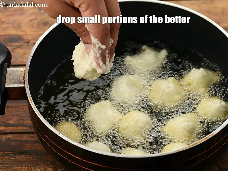 Step 45 – Drop small portions of the batter into hot oil and deep-fry, a few pakodis at …