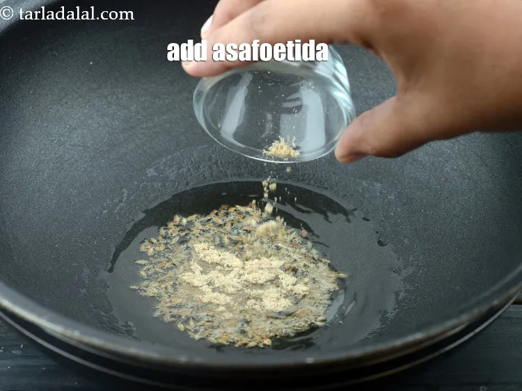 Step 13 – Add 1/4 tsp&nbsp;<a href="https://www.tarladalal.com/glossary-asafoetida-hing-113i">asafoetida (hing)</a>.