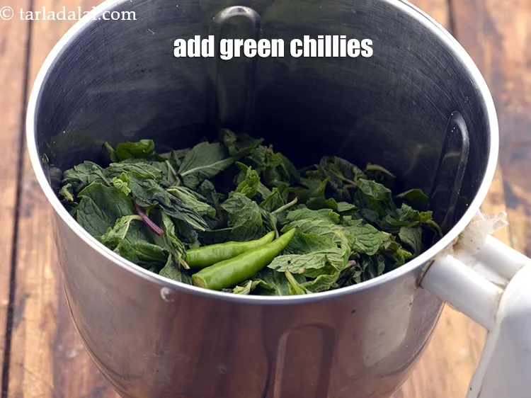 Step 13 – Then add 2&nbsp;<a href="https://www.tarladalal.com/glossary-green-chillies-hari-mirch-331i">green chillies</a>, roughly chopped. This will give a spicy kick to the&nbsp;<strong>dahi …