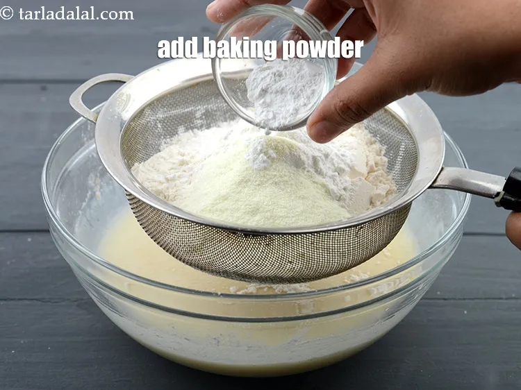 Step 13 – Add 1 tsp <a href="https://www.tarladalal.com/glossary-baking-powder-425i">baking powder</a>.
