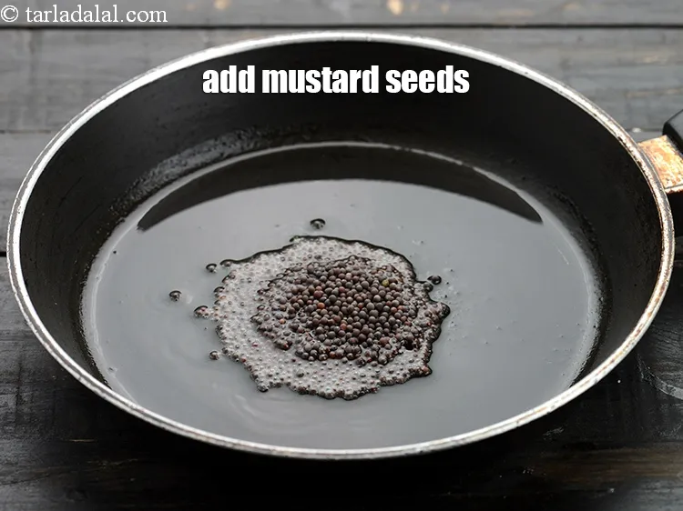 Step 14 – Add 1 tsp&nbsp;<a href="https://www.tarladalal.com/glossary-mustard-seeds-sarson-rai-sarson-ke-beej-525i">mustard seeds ( rai / sarson)</a>.&nbsp;