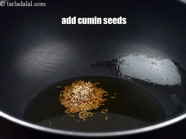Step 13 – Add 1 tsp <a href="https://www.tarladalal.com/glossary-cumin-seeds-jeera-zeera-381i">cumin seeds (jeera)</a>.