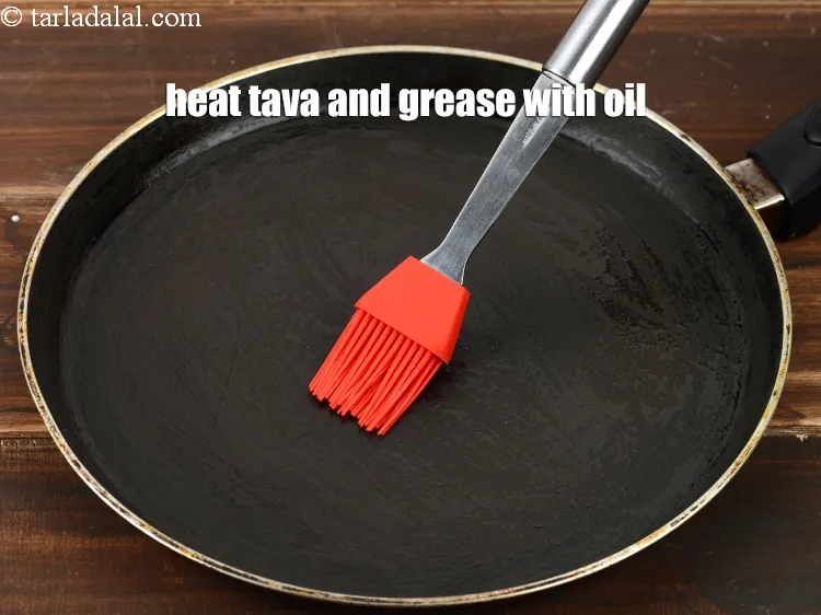 Step 13 – Heat a non-stick tava (griddle) and grease it with little oil.