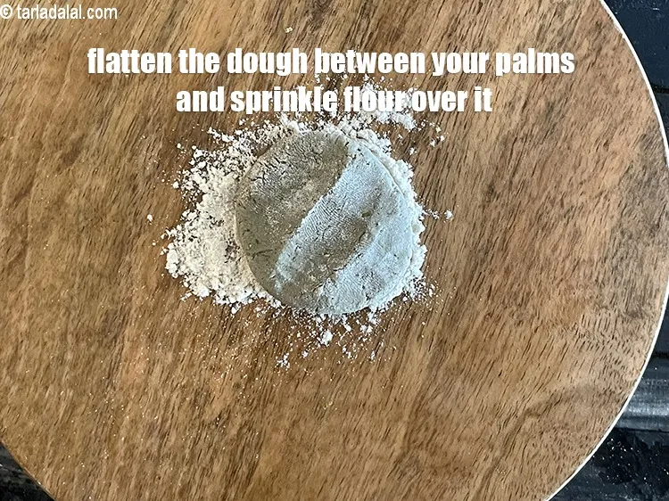 Step 13 – <meta charset="UTF-8" />Take a portion of the dough and flatten it between your palms.&nbsp;&nbsp;