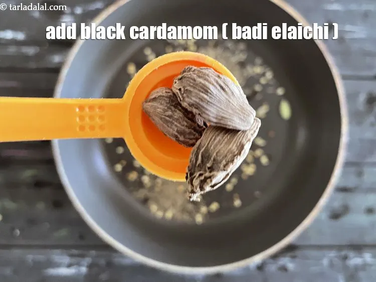 Step 13 – Add&nbsp;<meta charset="UTF-8" />2 to 3&nbsp;<a href="glossary-black-cardamom-badi-elaichi-moti-elaichi-263i">black cardamom (badi elaichi)</a>.