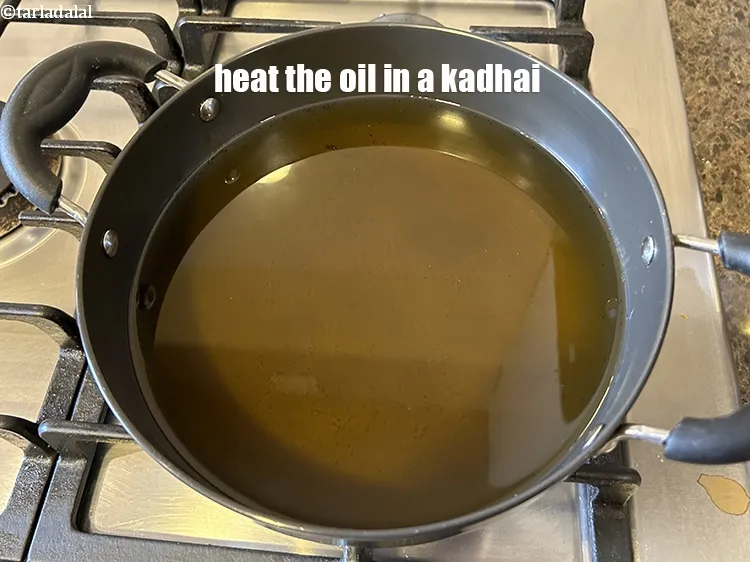 Step 26 – Heat the oil in a kadhai.