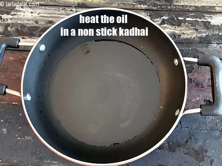Step 14 – Heat 4 tablespoons&nbsp;oil in a non-stick kadhai.