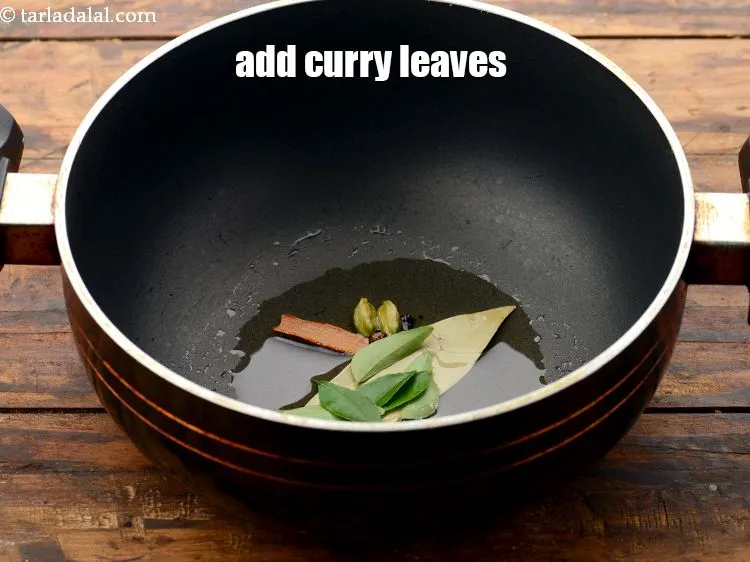 Step 22 – Add <a href="https://www.tarladalal.com/glossary-curry-leaves-kadi-patta-kadipatta-388i" target="_blank">curry leaves</a>.