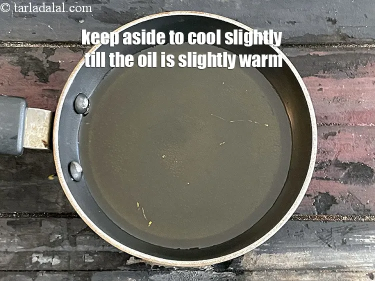 Step 21 – Keep aside to cool slightly till the oil is warm.