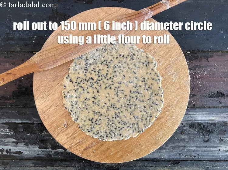 Step 12 – Roll out each portion into a 150 mm. (6&quot;) diameter thin circle, using a little …