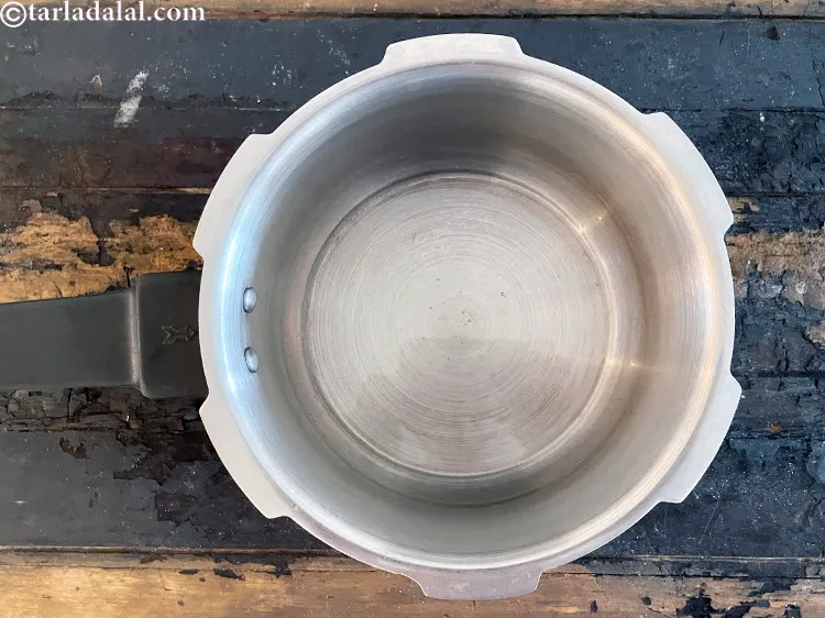 Step 30 – Heat 2 tbsp ghee in a pressure cooker.