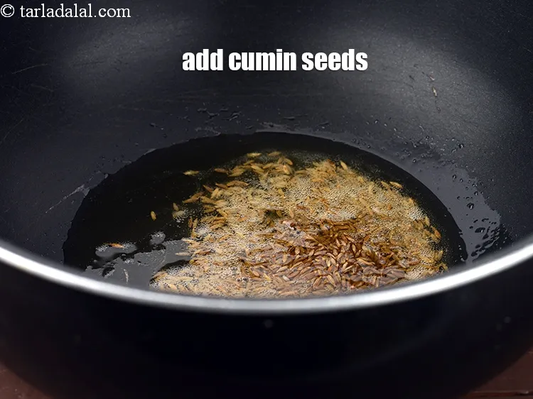 Step 14 – Add 2 tsp <a href="https://www.tarladalal.com/glossary-cumin-seeds-jeera-zeera-381i">cumin seeds (jeera)</a>.&nbsp;