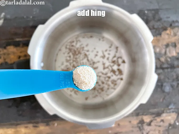 Step 21 – Add&nbsp;<meta charset="UTF-8" />1/4 tsp&nbsp;<a href="glossary-asafoetida-hing-113i">asafoetida (hing)</a>.