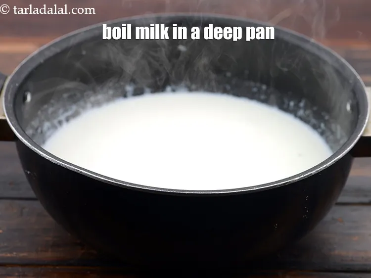 Step 13 – Boil 4 1/2 cups&nbsp;full-fat&nbsp;milk&nbsp;in a deep non-stick pan.