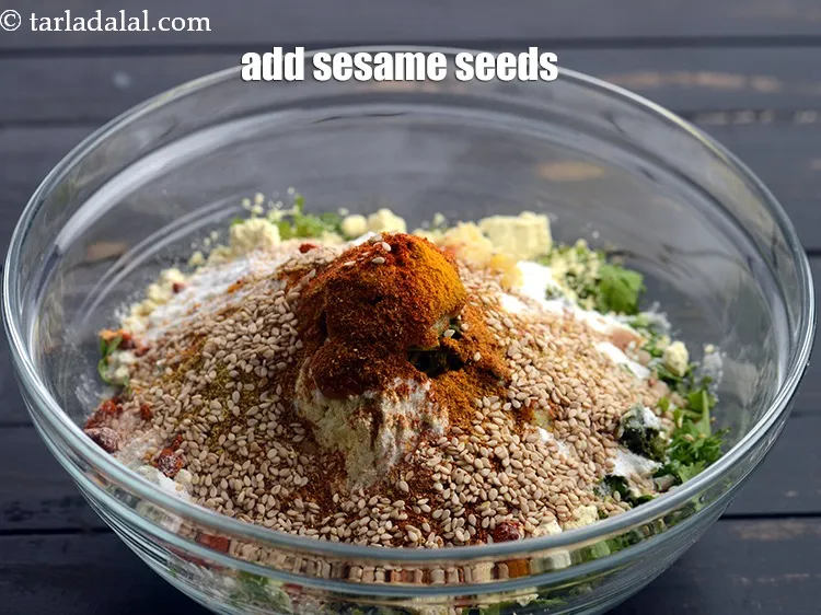 Step 13 – Add 1 tbsp <a href="https://www.tarladalal.com/glossary-sesame-seeds-til-gingelly-seeds-612i">sesame seeds (til)</a>.
