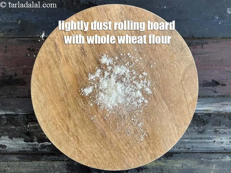 Step 14 – <meta charset="UTF-8" />Lightly dust the rolling board using little whole wheat flour.&nbsp;&nbsp;
