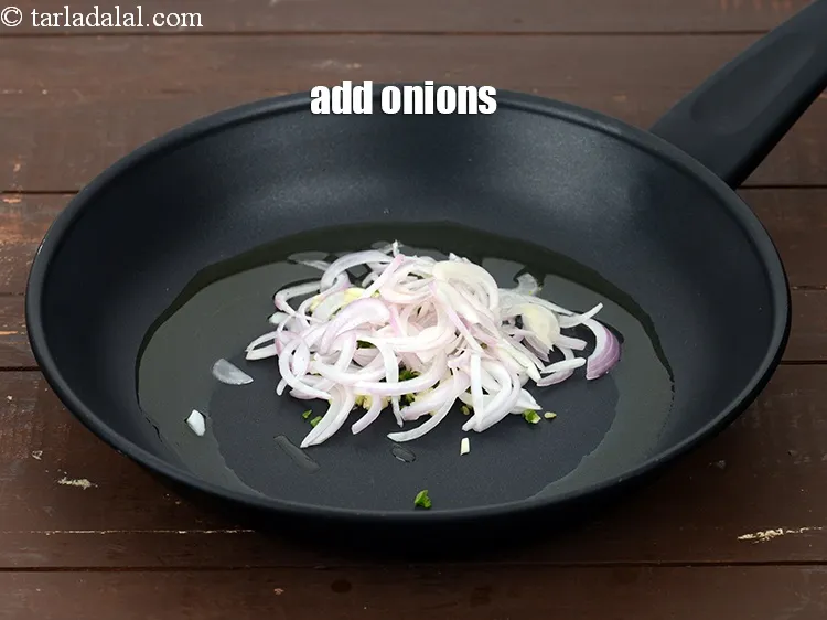 Step 13 – Add 1/2 cup&nbsp;thinly&nbsp;<a href="https://www.tarladalal.com/glossary-sliced-onions-745i">sliced onions</a>.&nbsp;
