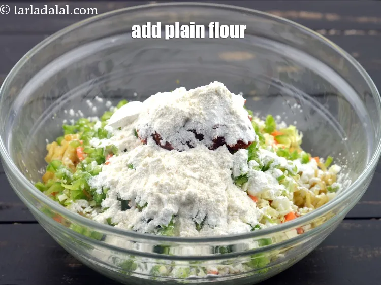 Step 15 – Add 2 1/2 tbsp&nbsp;<a href="https://www.tarladalal.com/glossary-plain-flour-maida-188i">plain flour (maida)</a>.