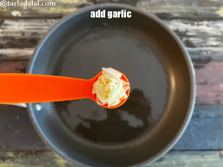 Step 13 – Add 2&nbsp;tsp&nbsp;<a href="glossary-crushed-garlic-870i">crushed garlic (lehsun)</a>.