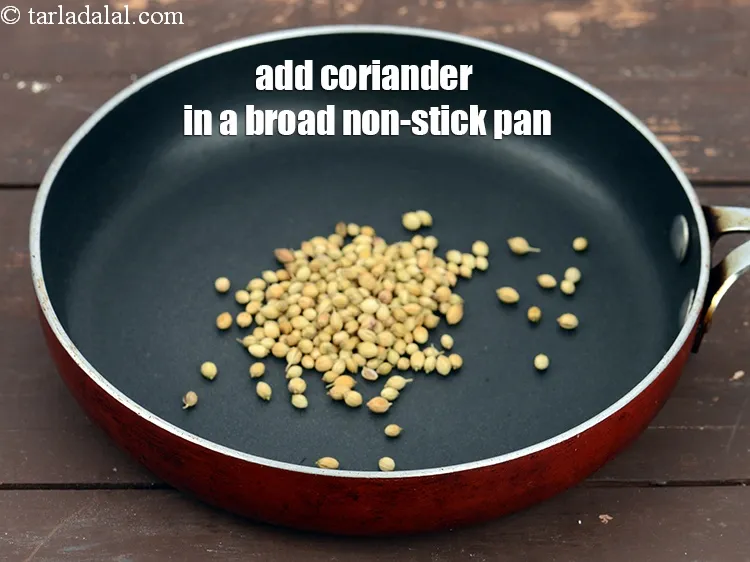 Step 14 – For the marinade, add 1 tbsp&nbsp;<a href="https://www.tarladalal.com/glossary-coriander-dhania-kothmir-369i">coriander (dhania)</a> in a broad non-stick pan.