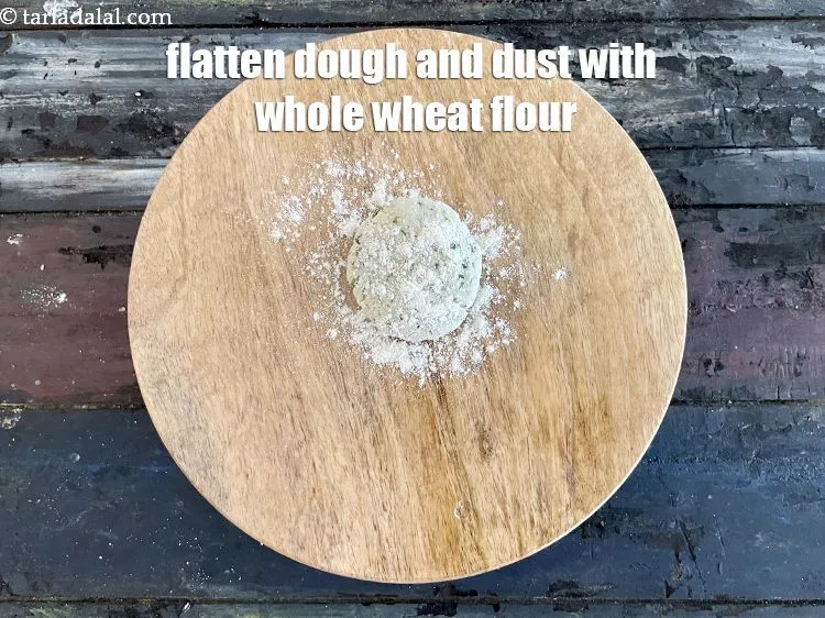 Step 15 – Flatten the dough on a rolling board and dust with whole wheat flour.