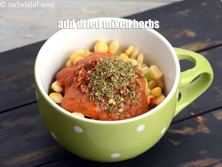 Step 13 – Add &frac12; tsp <a href="https://www.tarladalal.com/glossary-dried-mixed-herbs-466i">dried mixed herbs</a>.