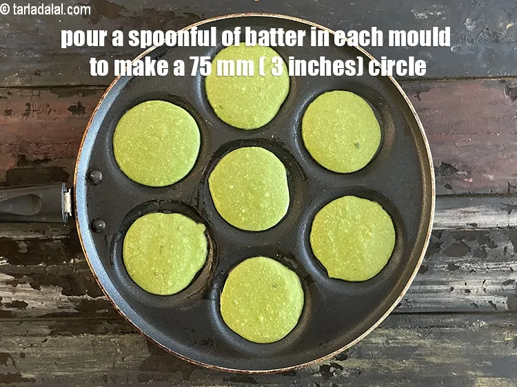 Step 20 – Pour a spoonful of the batter in each uttapa mould to make a 75 mm. …