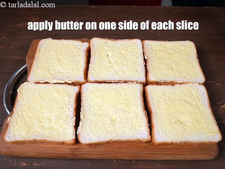 Step 13 – <p>Apply ½ tbsp of <a href="https://www.tarladalal.com/glossary-butter-makhan-233i">butter</a> on one side of each slice.</p>