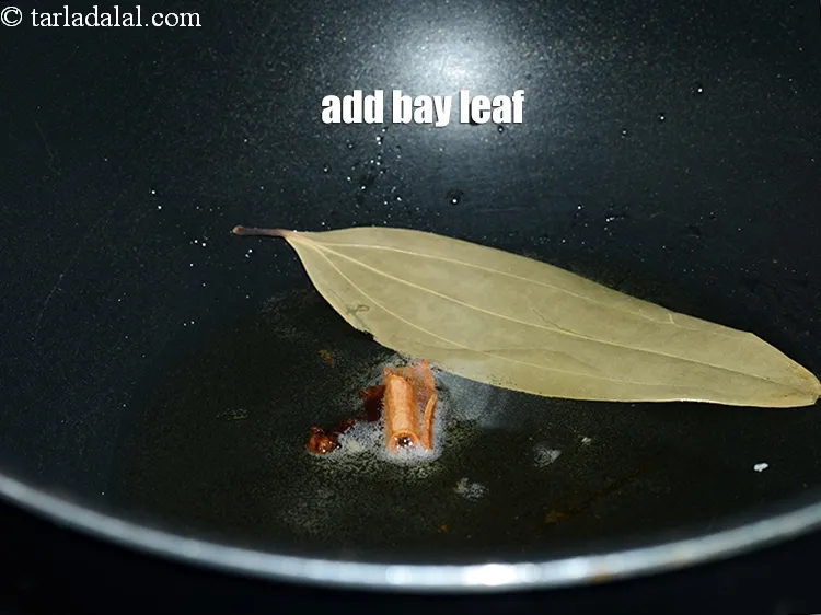Step 13 – Add 1 <a href="https://www.tarladalal.com/glossary-bay-leaf-tejpatta-bay-leaves-189i">bay leaf (tejpatta)</a>.