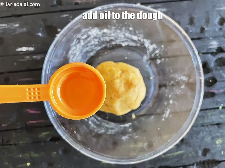 Step 14 – <meta charset="UTF-8" /> Add &frac14; tsp of oil to the dough.
