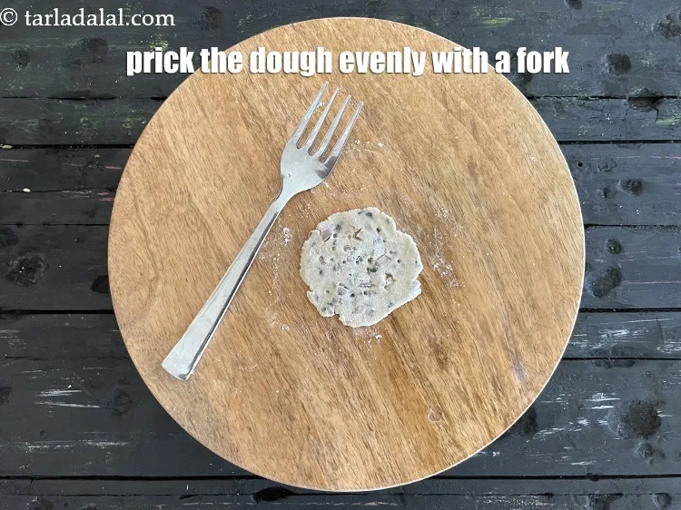 Step 24 – <p>Prick each puri evenly with a fork at regular intervals.&nbsp;Pricking ensures that the puri won’t …
