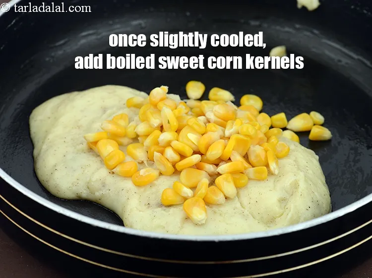Step 13 – Once slightly cooled, add 1/4 cup&nbsp;<a href="https://www.tarladalal.com/glossary-boiled-sweet-corn-kernels-153i">boiled sweet corn kernels (makai ke dane)</a>.