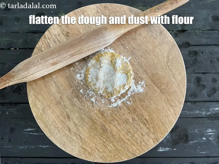 Step 16 – Flatten the dough and dust with flour on a rolling board.