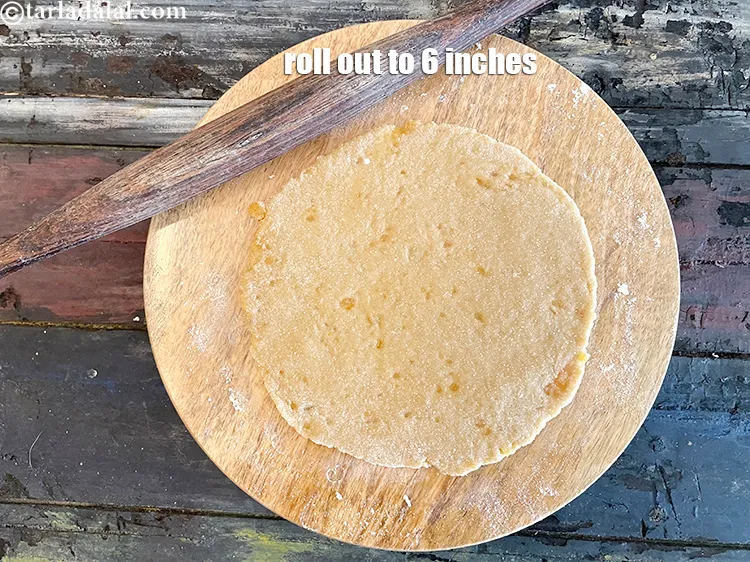 Step 14 – Roll out each portion into a 150 mm (6&quot;) diameter circle using a little whole …