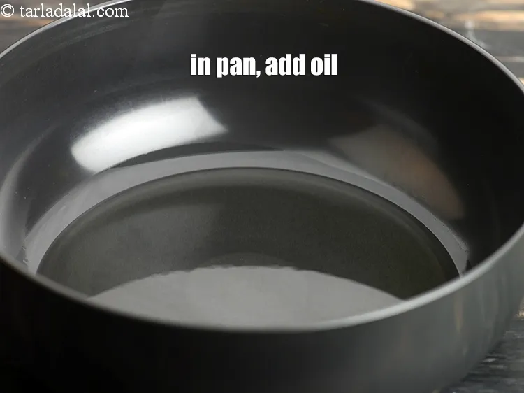 Step 14 – In a deep pan, add 3 tbsp oil.