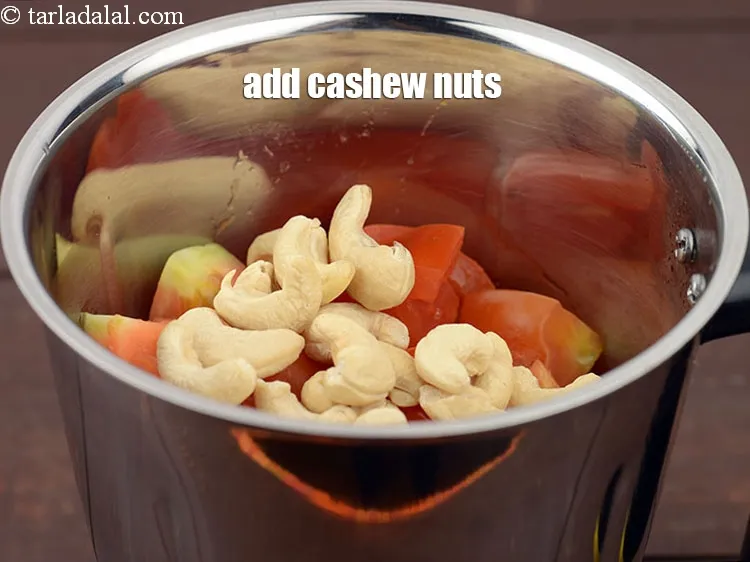 Step 13 – Add &frac14; cup <a href="https://www.tarladalal.com/glossary-cashew-nuts-kaju-840i">cashew nuts (kaju)</a>.