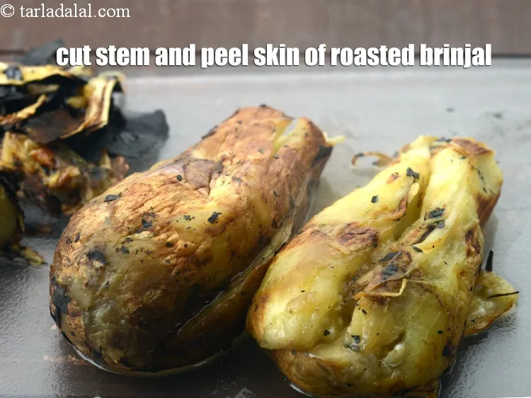 Step 13 – Cut the stem and peel the skin of the roasted brinjal.