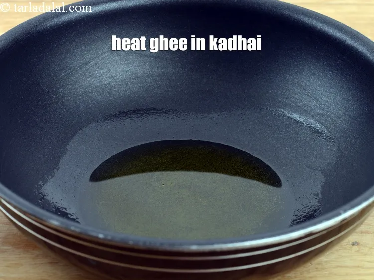 Step 14 – Heat 2 tbsp&nbsp;<a href="https://www.tarladalal.com/glossary-ghee-245i">ghee</a> in a kadhai.
