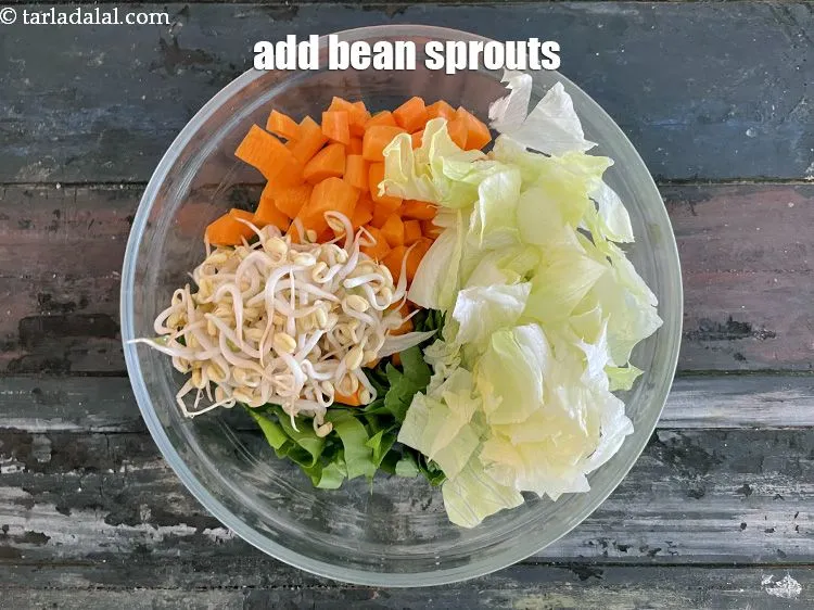Step 20 – Add&nbsp;<meta charset="UTF-8" />1/2 cup&nbsp;<a href="glossary-bean-sprouts-193i">bean sprouts</a>.