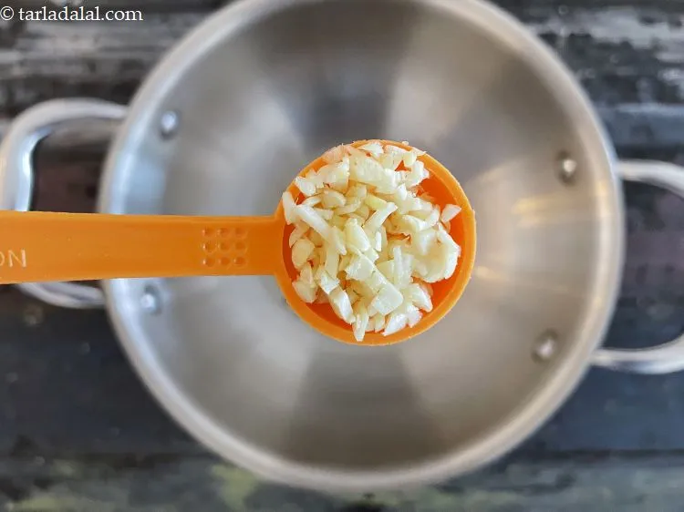 Step 22 – Add 1 tsp&nbsp;finely&nbsp;<a href="glossary-chopped-garlic-790i">chopped garlic (lehsun)</a>.