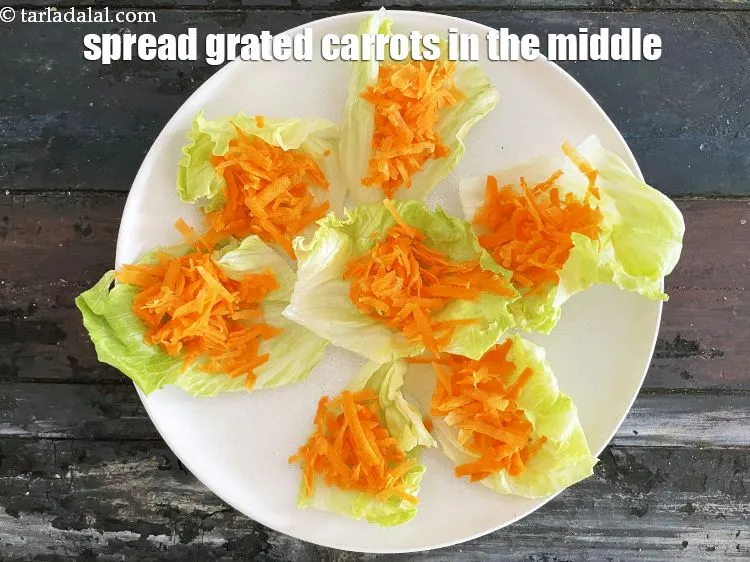 Step 15 – Spread the grated carrots in the middle